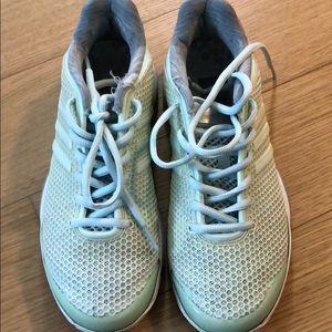 Stella McCarthy x Adidas tennis shoes.